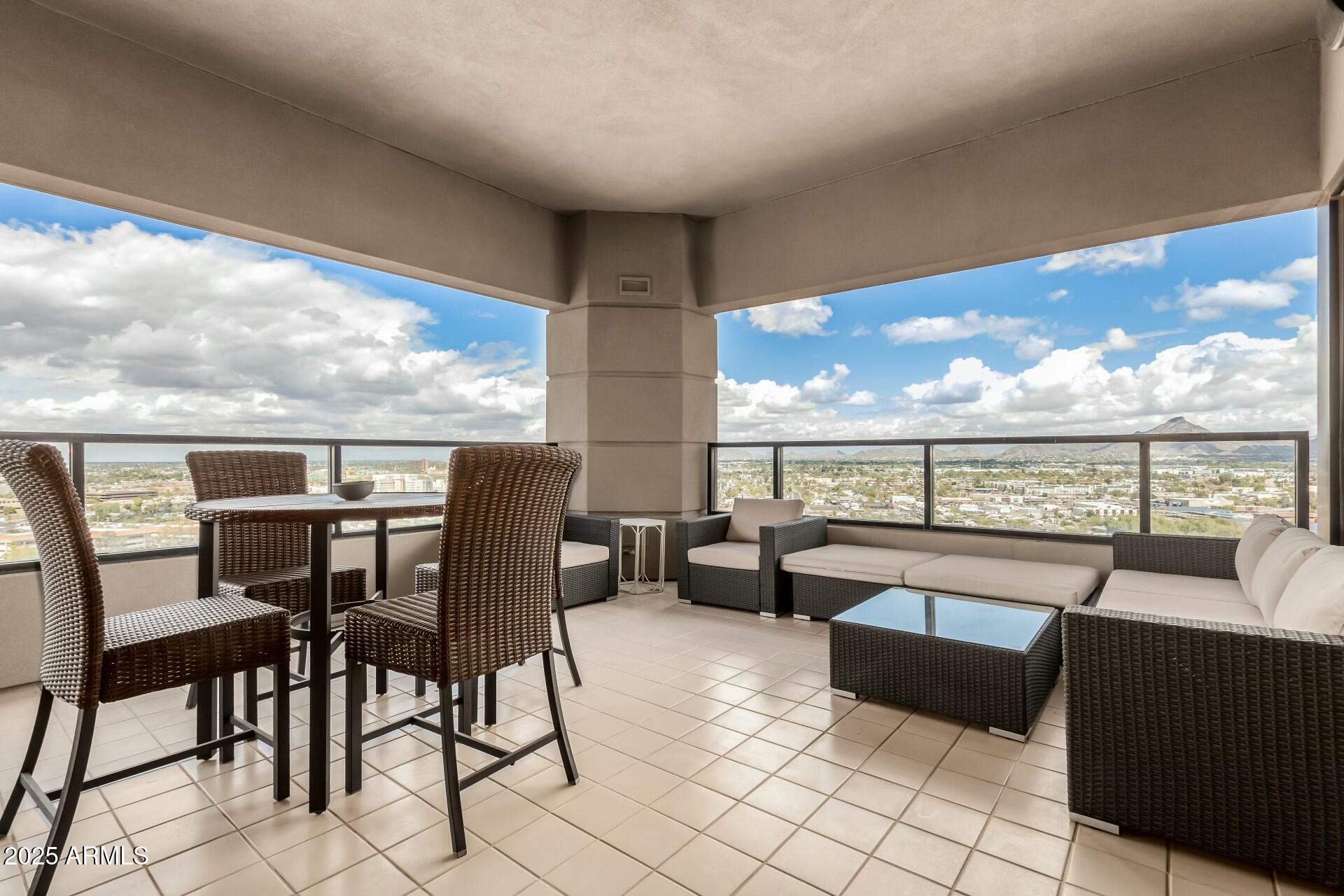 1040 East Osborn Road, Unit 1803 Phoenix, AZ 85014 - Photo 33 of 44 a view of a chairs and table in patio