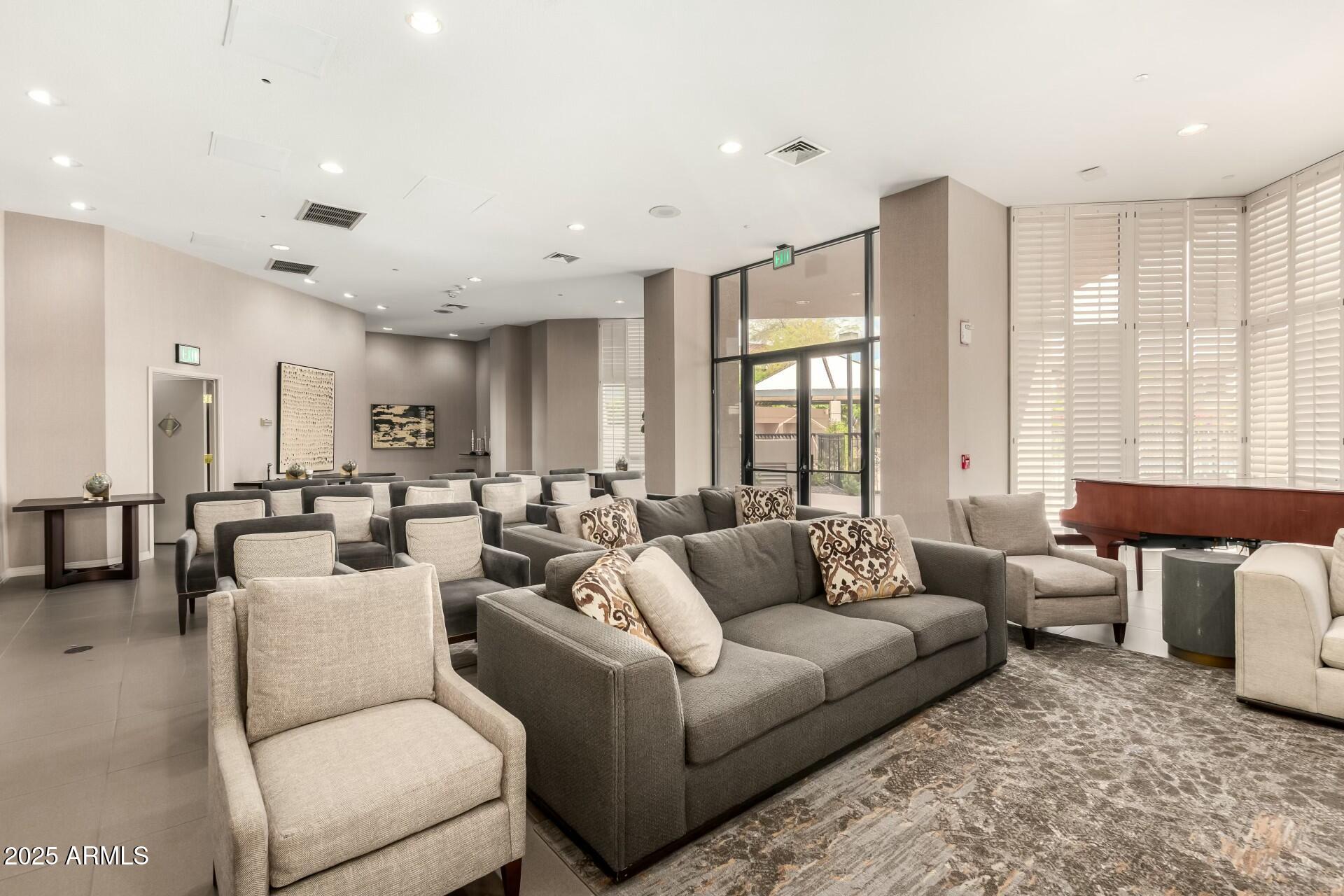 1040 East Osborn Road, Unit 1803 Phoenix, AZ 85014 - Photo 34 of 44 a living room with furniture and a large window