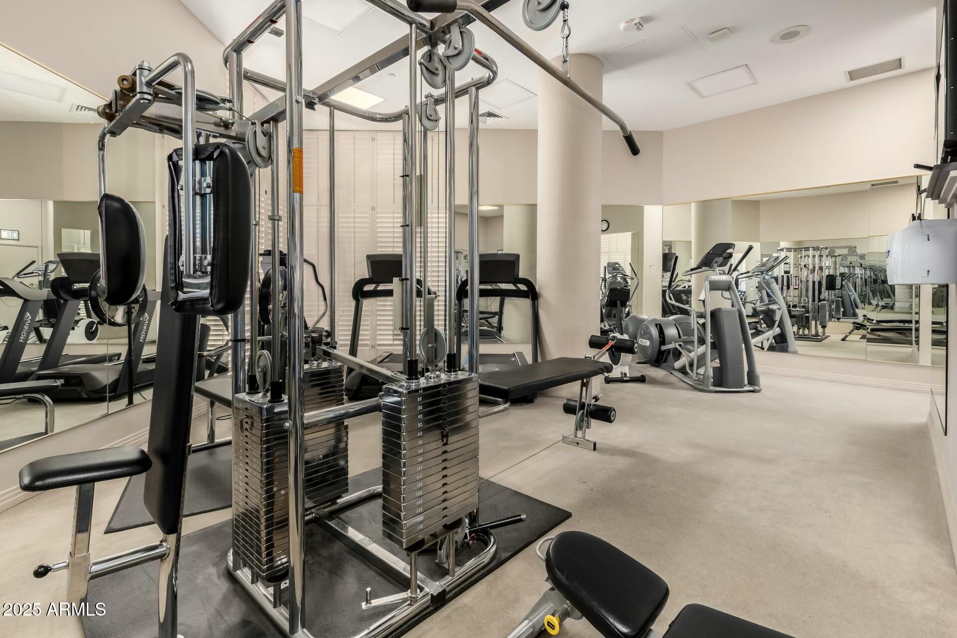 1040 East Osborn Road, Unit 1803 Phoenix, AZ 85014 - Photo 35 of 44 a view of a room with gym equipment