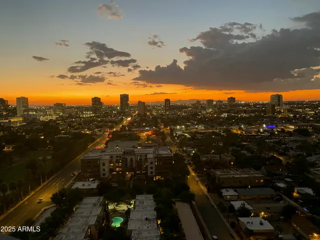a view of a swimming pool with a yard