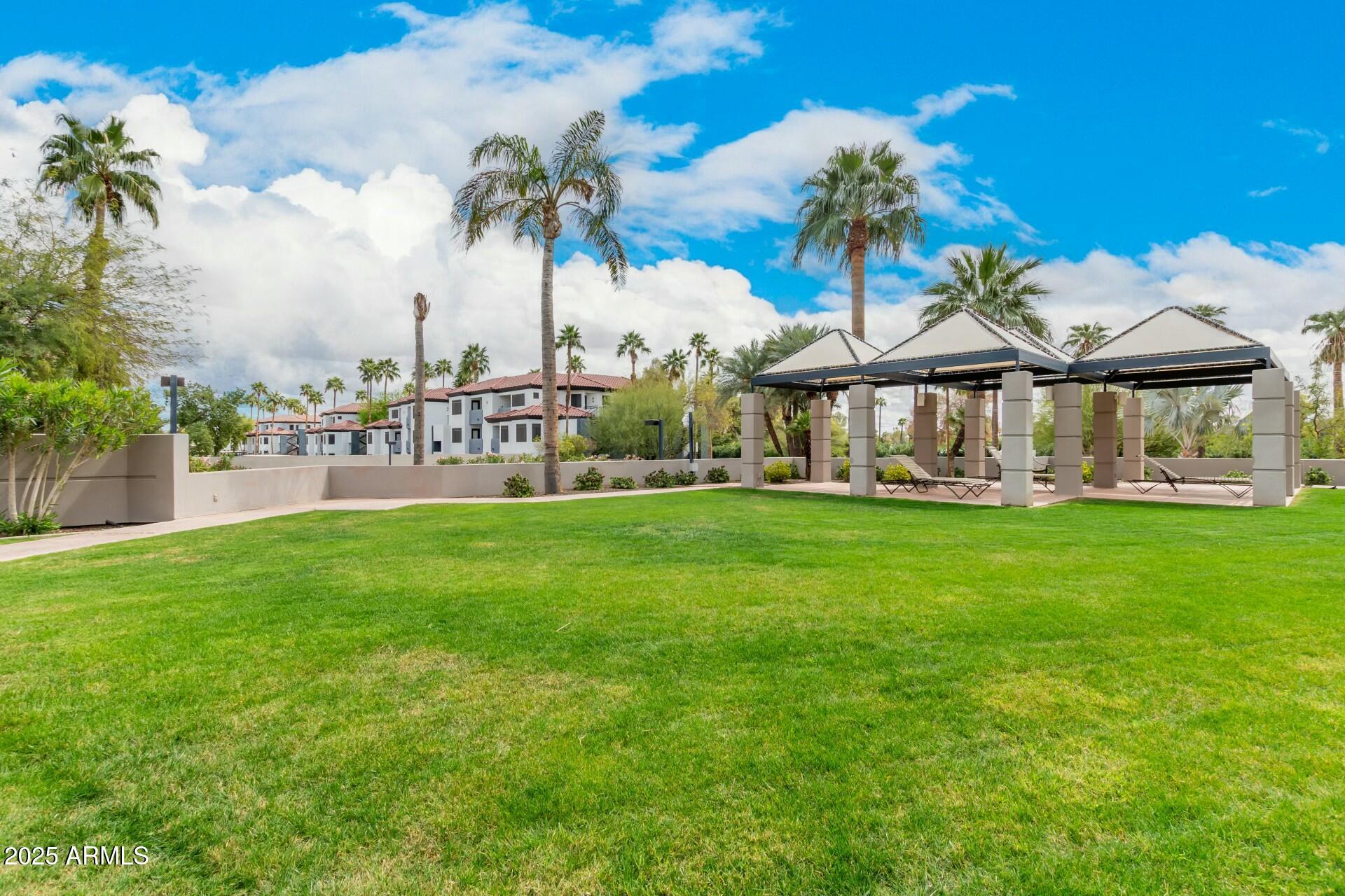 1040 East Osborn Road, Unit 1803 Phoenix, AZ 85014 - Photo 42 of 44 a view of a house with a big yard