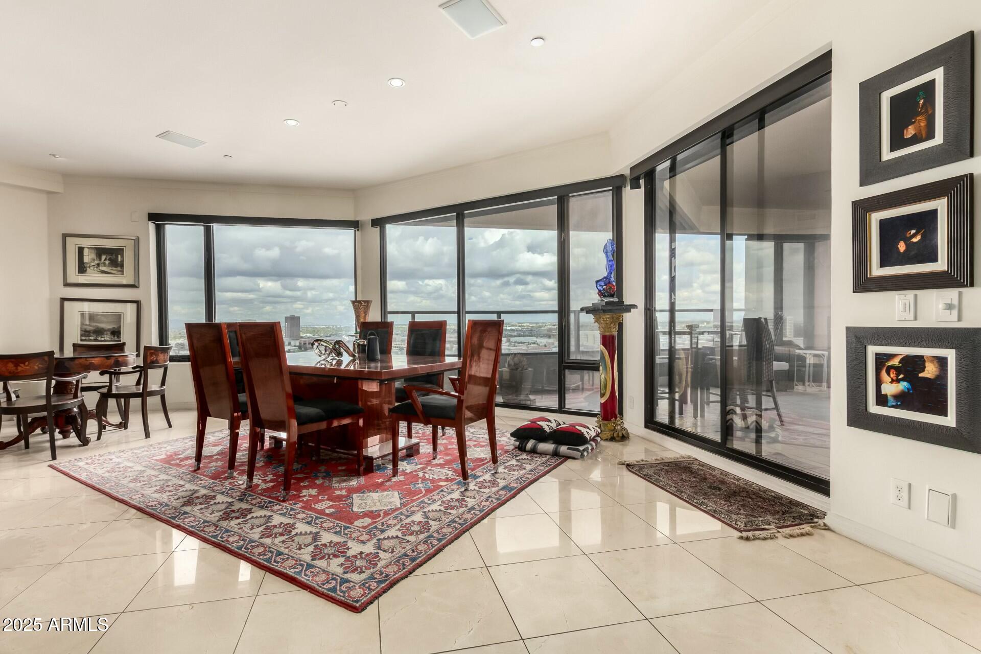 1040 East Osborn Road, Unit 1803 Phoenix, AZ 85014 - Photo 8 of 44 a view of a dining room with furniture window and outside view