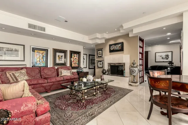 a living room with lots of furniture and a table