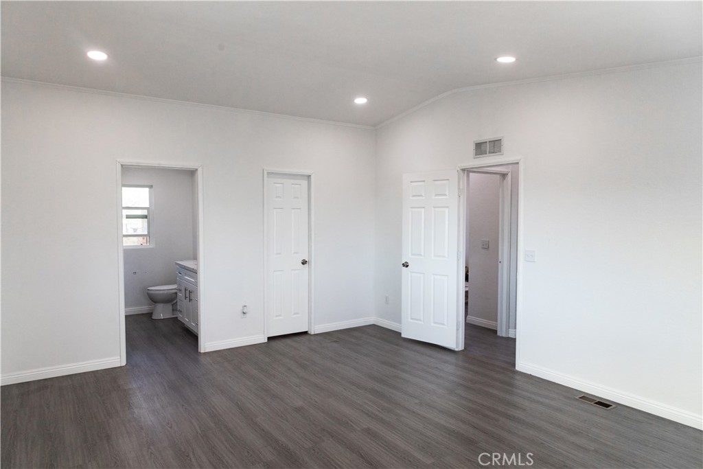 56515 Dickson Way Anza, CA 92539 - Photo 9 of 17 a view of an empty room with wooden floor and closet