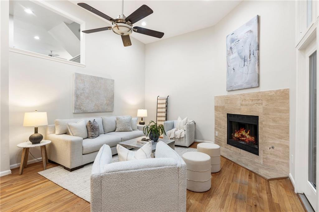 4010 Roswell Road Northeast, Unit 7 Atlanta, GA 30342 - Photo 1 of 36 a living room with furniture and a fireplace