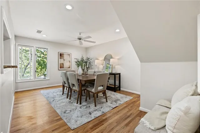 a kitchen with stainless steel appliances granite countertop a stove and a refrigerator