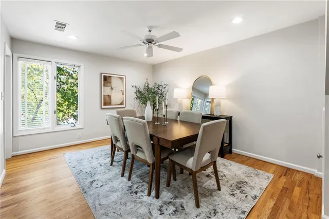 a kitchen with stainless steel appliances granite countertop a stove and a wooden cabinets