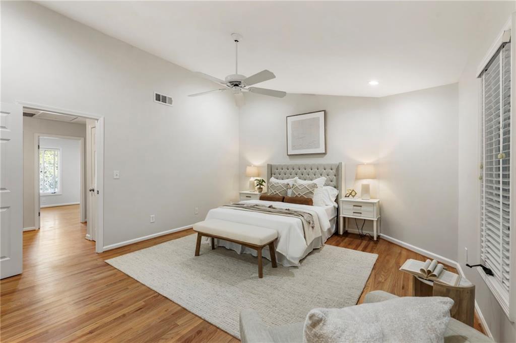 4010 Roswell Road Northeast, Unit 7 Atlanta, GA 30342 - Photo 21 of 36 a spacious bedroom with a bed and a table