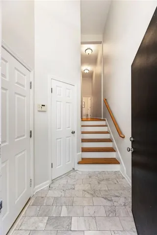 a view of a livingroom with furniture and windows
