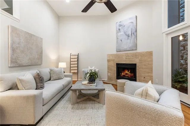 a living room with furniture and a potted plant
