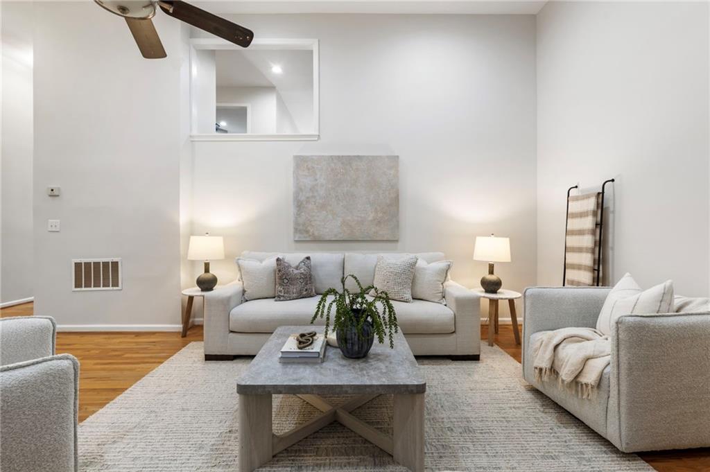 4010 Roswell Road Northeast, Unit 7 Atlanta, GA 30342 - Photo 8 of 36 a living room with furniture and a potted plant