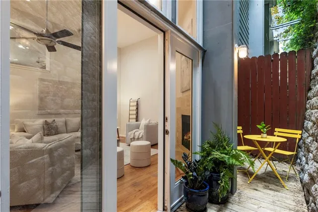 a dining room with furniture and wooden floor
