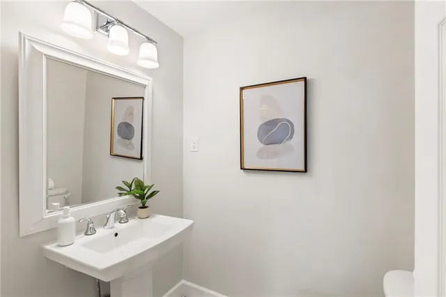 a view of a dining room with furniture and a window