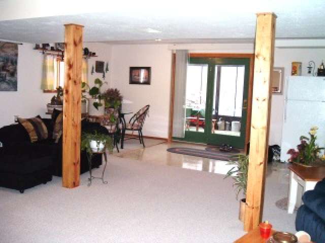 10456 East Felts Road Davis, IL 61019 - Photo 4 of 5 a living room filled with furniture and a floor to ceiling window