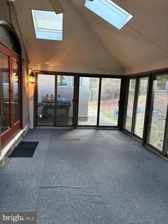 a view of a big room with an outdoor view and a lake view