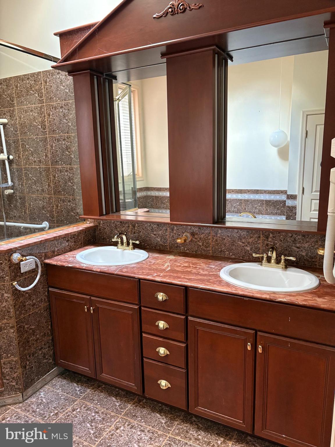 101 Robert Drive Wyomissing, PA 19610 - Photo 15 of 60 a bathroom with a granite countertop sink and a mirror