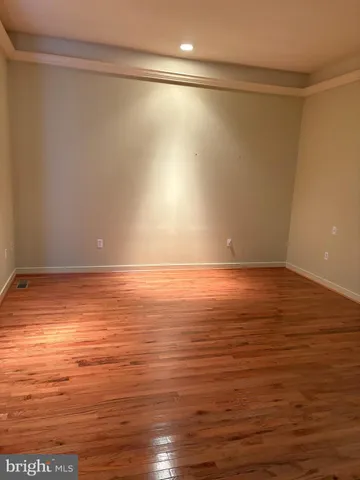 a bathroom with double vanity and a bathtub
