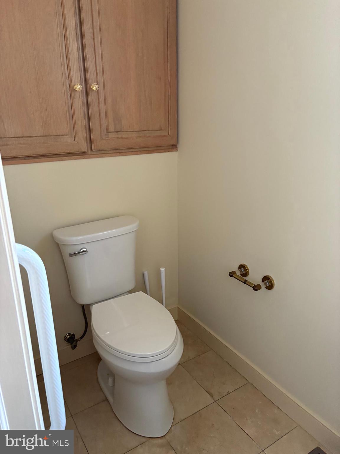 101 Robert Drive Wyomissing, PA 19610 - Photo 22 of 60 a white toilet sitting next to a bathroom sink