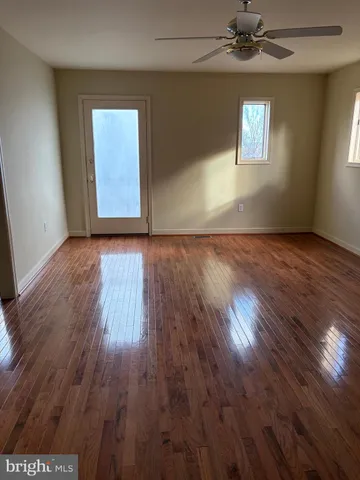 a white toilet sitting next to a shower