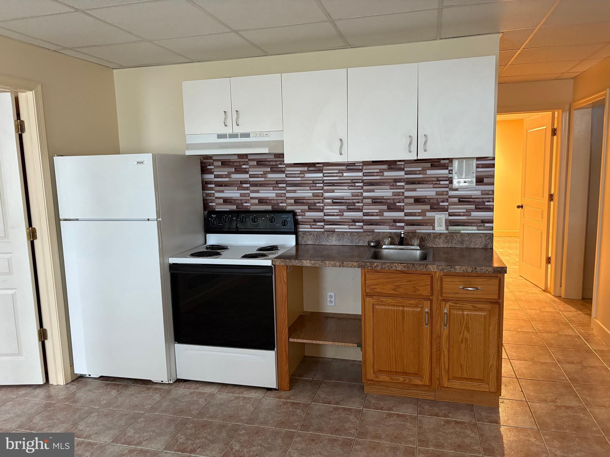 101 Robert Drive Wyomissing, PA 19610 - Photo 34 of 60 a kitchen with stainless steel appliances granite countertop a stove a refrigerator and a white cabinets