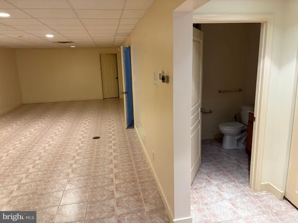 a view of a bathroom with a tub and shower
