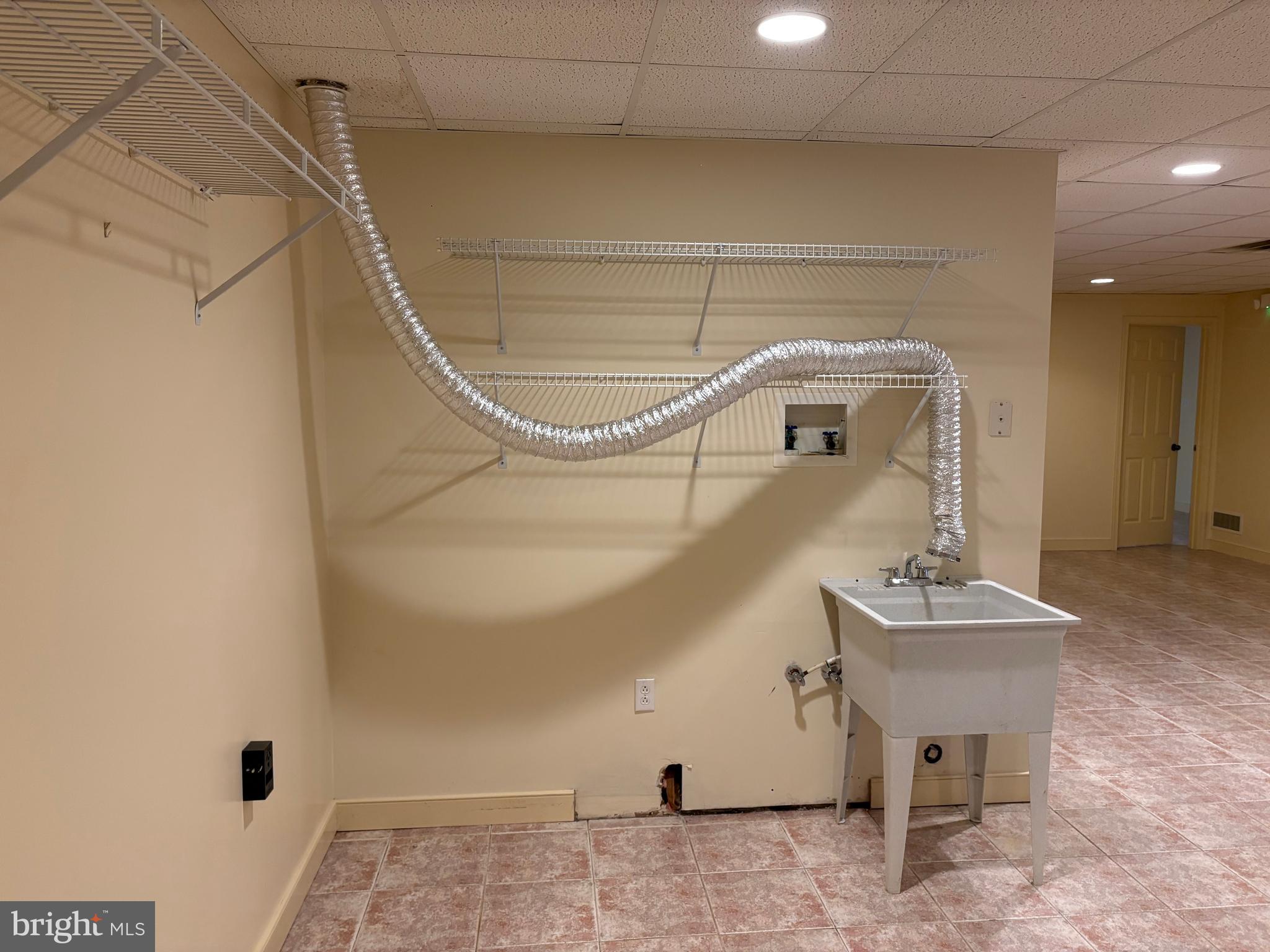 101 Robert Drive Wyomissing, PA 19610 - Photo 45 of 60 a bathroom with a sink and a mirror