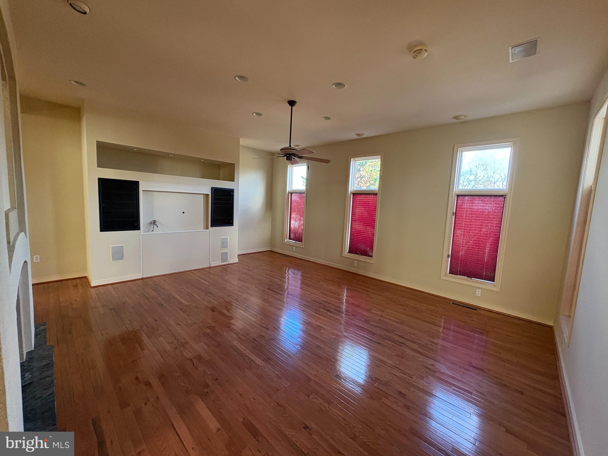 101 Robert Drive Wyomissing, PA 19610 - Photo 7 of 60 a view of an empty room with wooden floor and windows