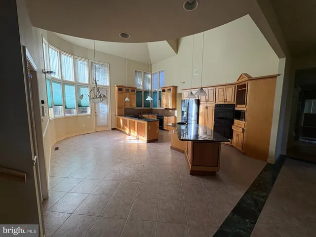a view of living room with furniture and a window