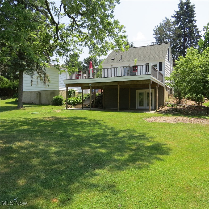 45560 North Ridge Road Amherst, OH 44001 - Photo 24 of 50 Rear view of property featuring a wooden deck, stairway, a lawn, and french doors