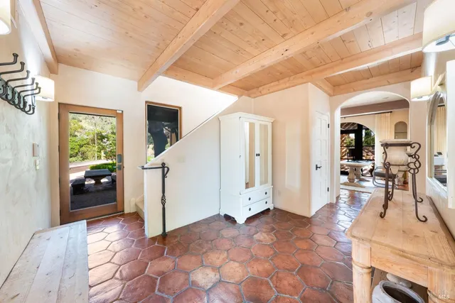 a bedroom with 2 bed and a window