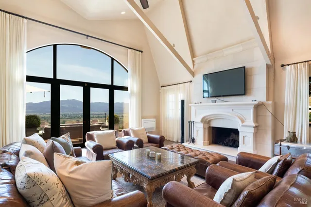 a living room with furniture fireplace and a flat screen tv