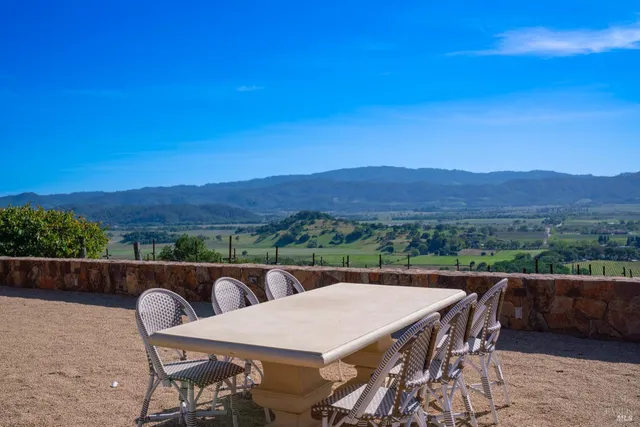 a view of a chairs and table in the terrace