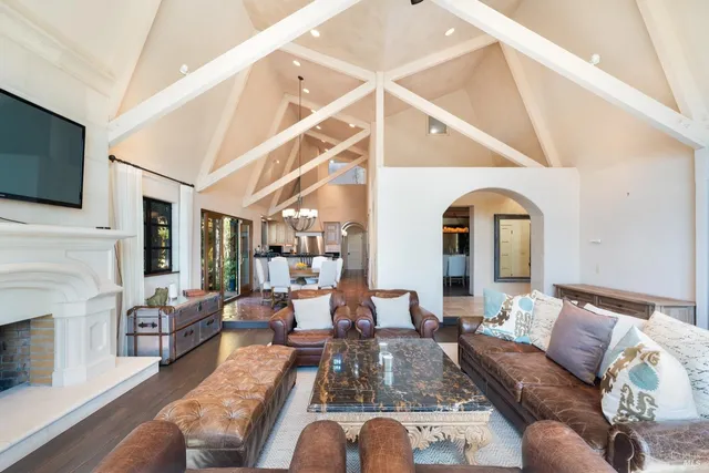 a living room with fireplace furniture and a flat screen tv
