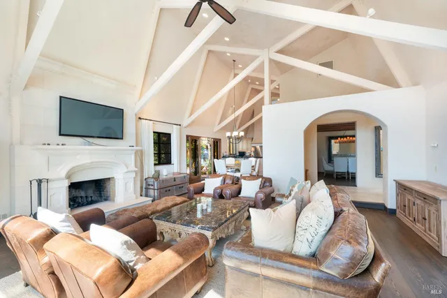 a living room with furniture fireplace and a flat screen tv