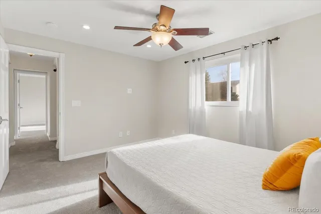 an aerial view of a house with swimming pool and outdoor seating