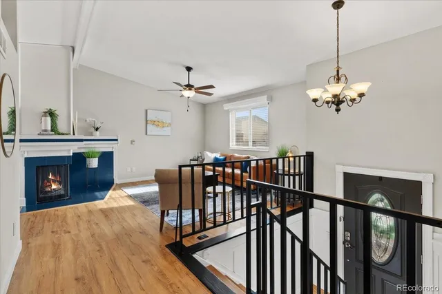 a bedroom with a bed and a ceiling fan