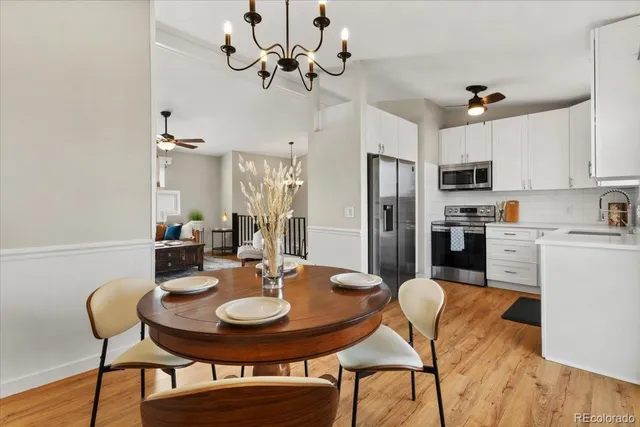 a bathroom with double vanity and a mirror