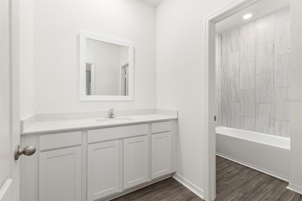 1645 Nantucket Way Winter Haven, FL 33884 - Photo 19 of 20 a bathroom with a bathtub and a sink
