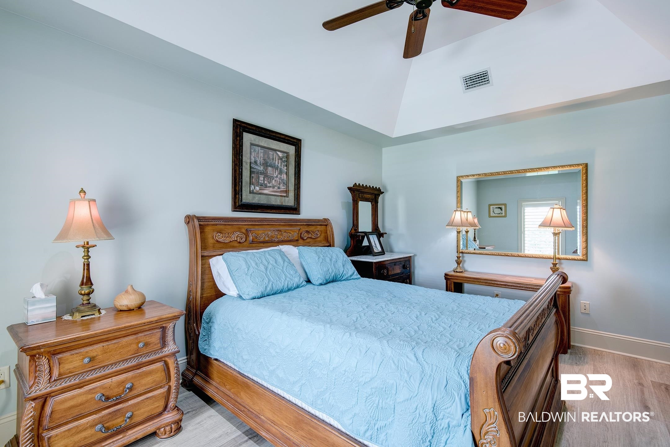 9357 Lakeview Drive Foley, AL 36535 - Photo 58 of 68 Spacious room featuring vaulted ceilings, wood-finish flooring, and light blue walls