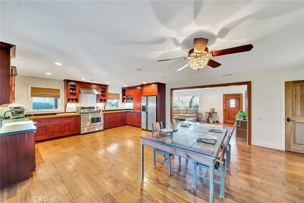 24201 St Edens Circle West Hills, CA 91307 - Photo 11 of 31 a living room with furniture kitchen view and a large window
