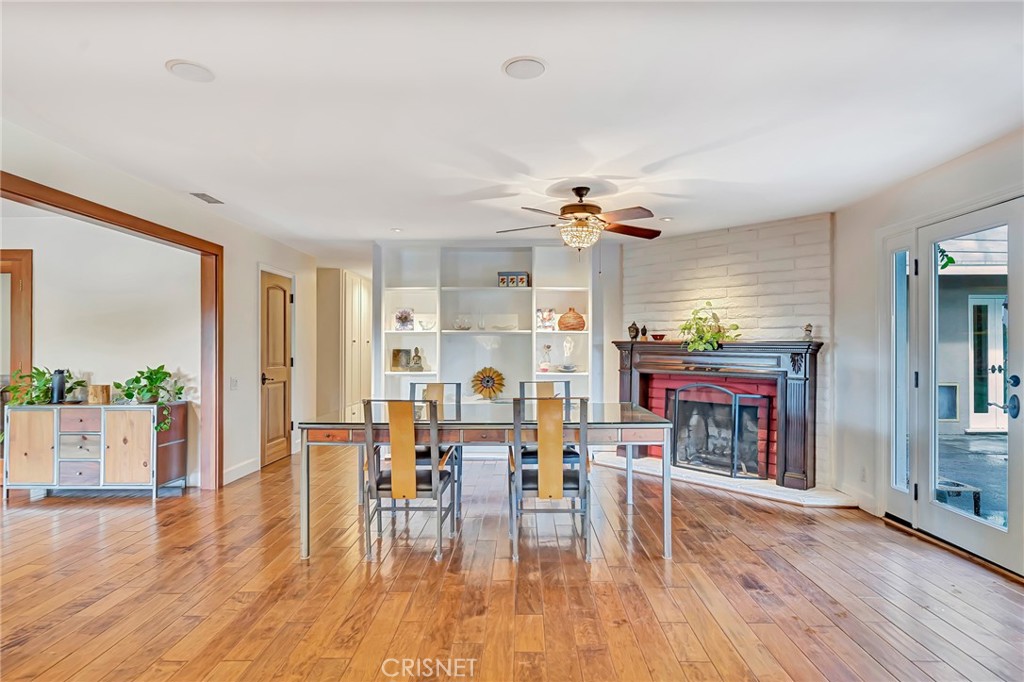 24201 St Edens Circle West Hills, CA 91307 - Photo 12 of 31 a living room with fireplace furniture and a wooden floor