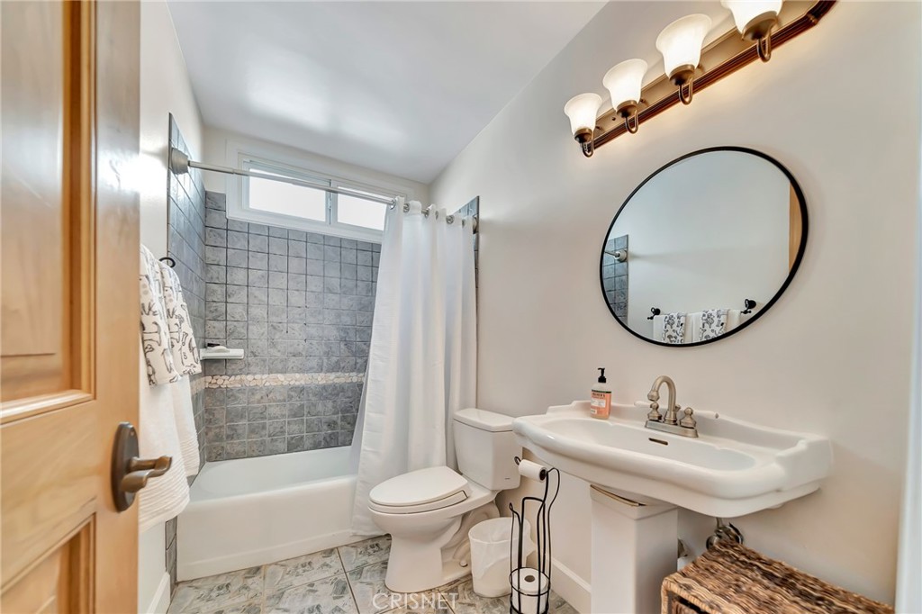 24201 St Edens Circle West Hills, CA 91307 - Photo 16 of 31 a bathroom with a sink toilet and shower