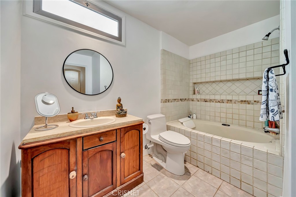 24201 St Edens Circle West Hills, CA 91307 - Photo 20 of 31 a bathroom with a toilet sink vanity granite and mirror