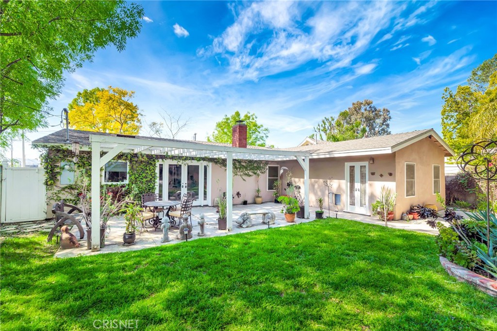 24201 St Edens Circle West Hills, CA 91307 - Photo 22 of 31 a view of a house with a garden and porch