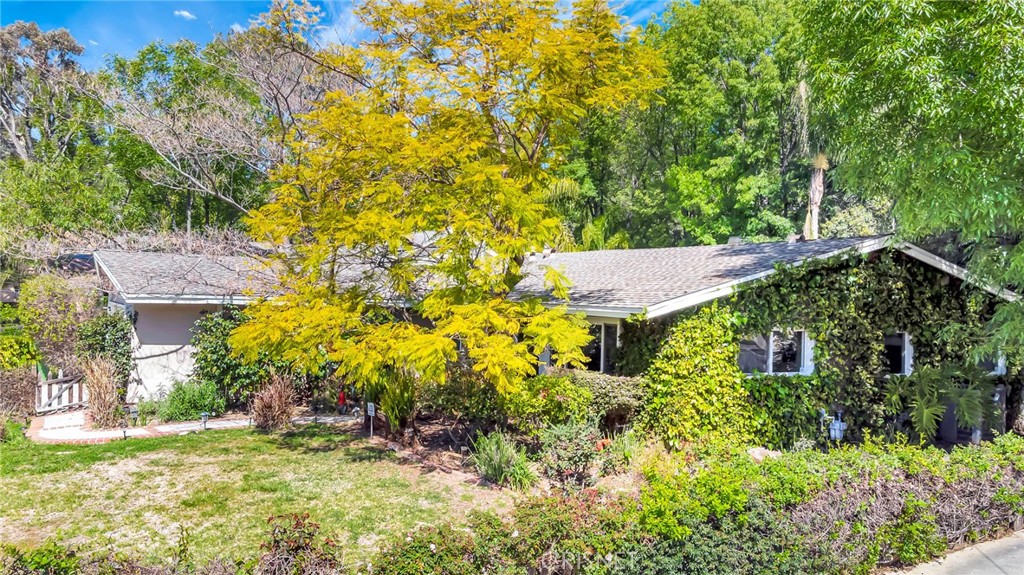 24201 St Edens Circle West Hills, CA 91307 - Photo 26 of 31 a view of a house with a yard