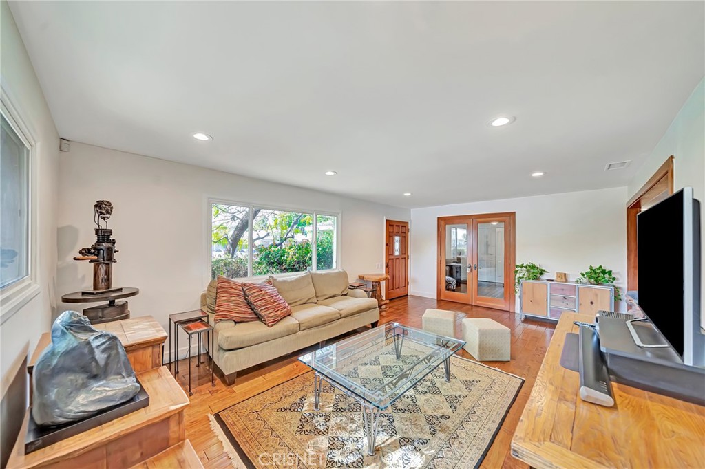 24201 St Edens Circle West Hills, CA 91307 - Photo 5 of 31 a living room with furniture and a flat screen tv
