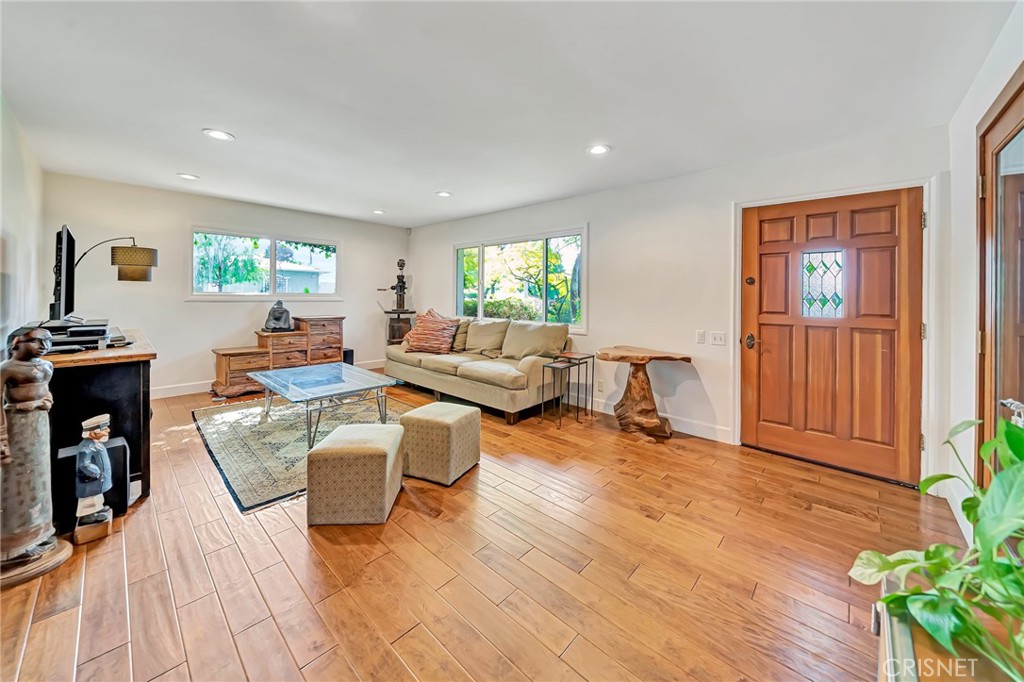 24201 St Edens Circle West Hills, CA 91307 - Photo 7 of 31 a living room with fireplace furniture and a flat screen tv