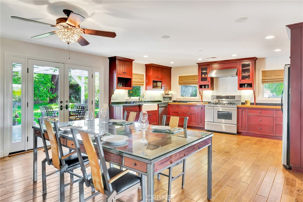 24201 St Edens Circle West Hills, CA 91307 - Photo 9 of 31 a kitchen with stainless steel appliances granite countertop a stove and a view of living room