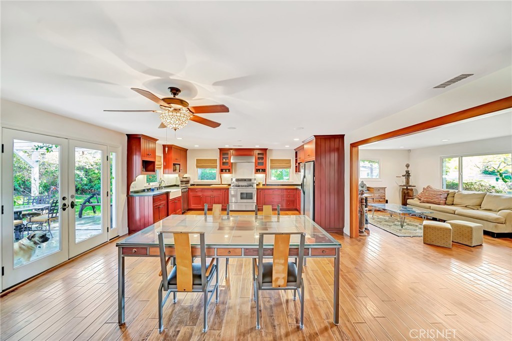 24201 St Edens Circle West Hills, CA 91307 - Photo 10 of 31 a dining room with furniture a chandelier and wooden floor