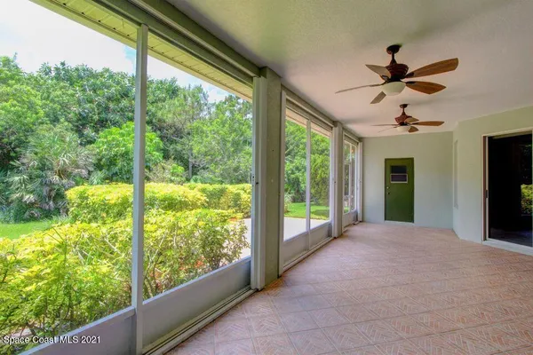 a view of a porch with a floor to ceiling window